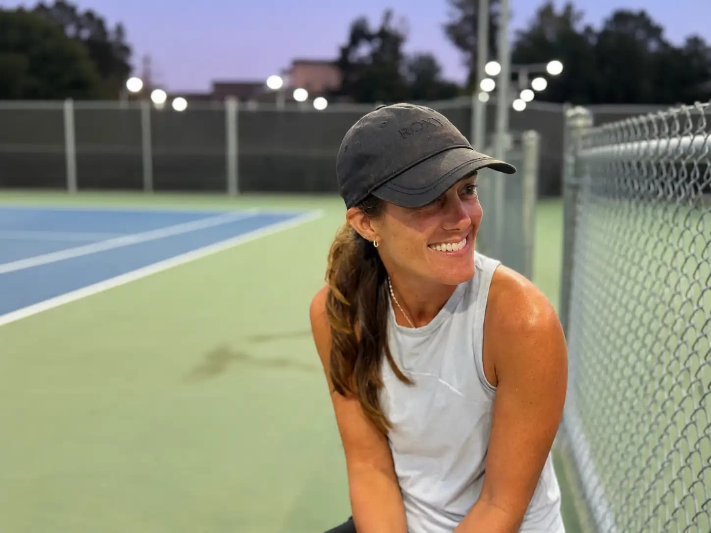 Nicole on a pickleball court